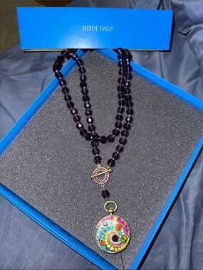 Heidi Daus Purple Crystal Bead Necklace with Multicolor Swirl Pendant.